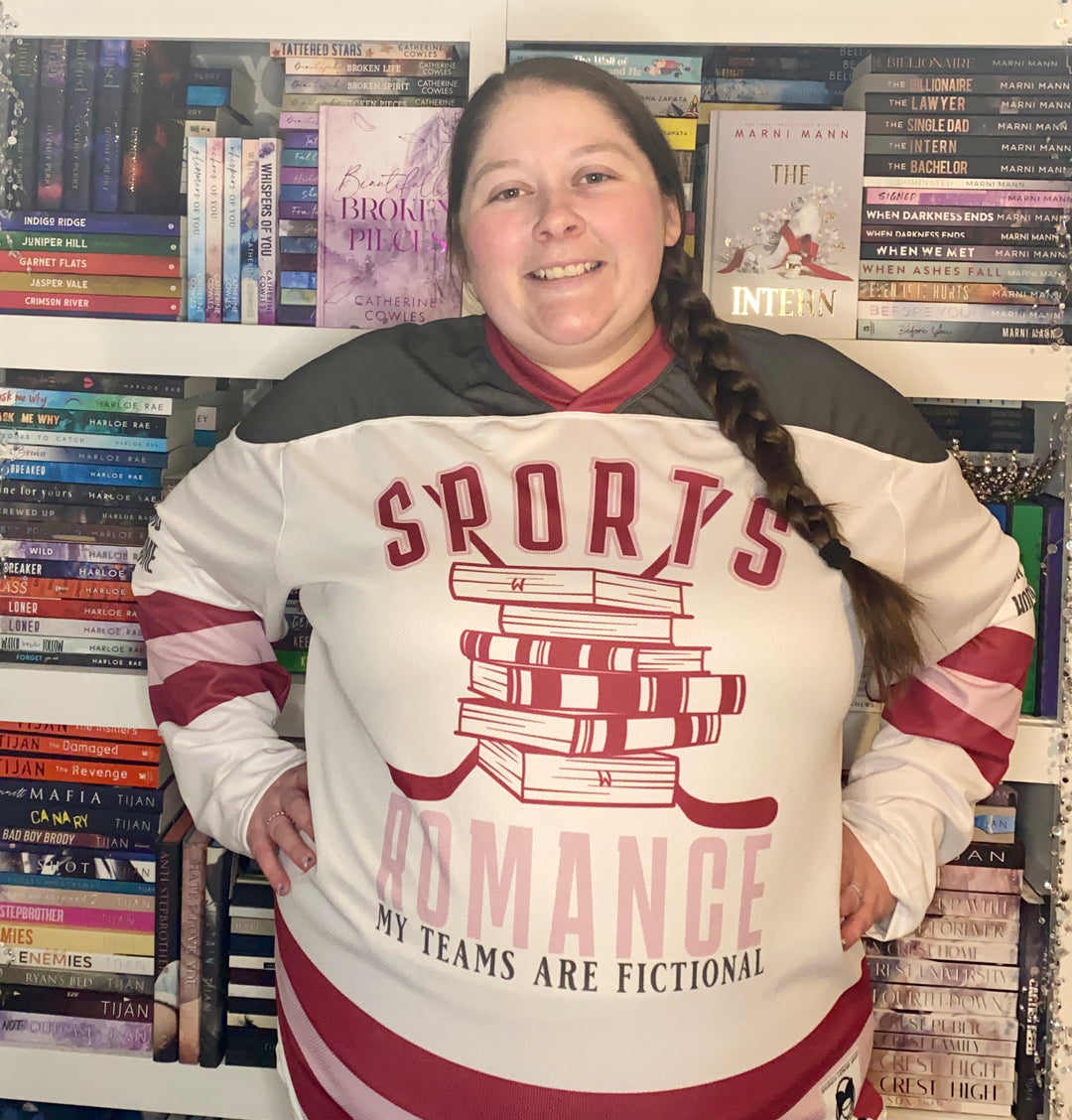 a woman standing in front of a book shelf